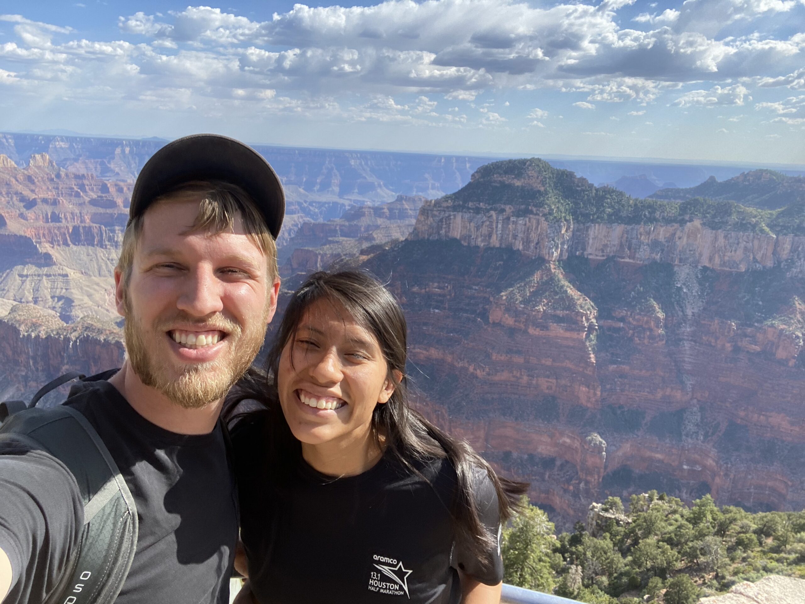 Scott and Dalia smiling together at an overlook on the Grand Canyon’s North Rim.